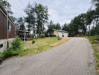 Welcome to your Lake Arrowhead getaway! This charming mobile on Sand Valley Golf Course in Wisconsin - for sale on GolfHomes.com, golf home, golf lot