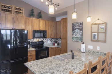 Experience the best of Aspen Meadows in this stunning 2-bedroom on Headwaters Golf Course At Granby Ranch in Colorado - for sale on GolfHomes.com, golf home, golf lot