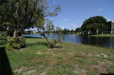 BEAUTIFUL 2 BED, 2 BATH FIRST FLOOR CONDO W GORGEOUS WATER VIEWS on Pine Island Ridge Country Club in Florida - for sale on GolfHomes.com, golf home, golf lot