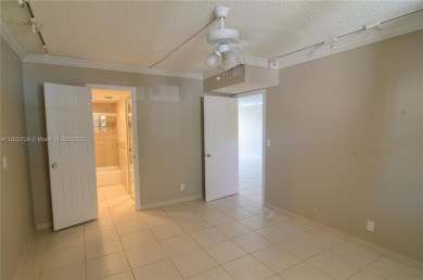 BEAUTIFUL 2 BED, 2 BATH FIRST FLOOR CONDO W GORGEOUS WATER VIEWS on Pine Island Ridge Country Club in Florida - for sale on GolfHomes.com, golf home, golf lot