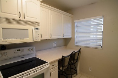 BEAUTIFUL 2 BED, 2 BATH FIRST FLOOR CONDO W GORGEOUS WATER VIEWS on Pine Island Ridge Country Club in Florida - for sale on GolfHomes.com, golf home, golf lot