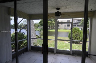 BEAUTIFUL 2 BED, 2 BATH FIRST FLOOR CONDO W GORGEOUS WATER VIEWS on Pine Island Ridge Country Club in Florida - for sale on GolfHomes.com, golf home, golf lot