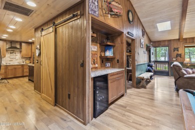 Charming single-level cabin in Pinetop Country Club, offering 1 on Pinetop Lakes Country Club in Arizona - for sale on GolfHomes.com, golf home, golf lot