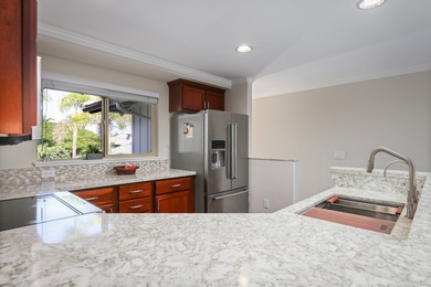 Discover refined island living with this beautifully updated top on Mauna Lani Resort Golf Course in Hawaii - for sale on GolfHomes.com, golf home, golf lot