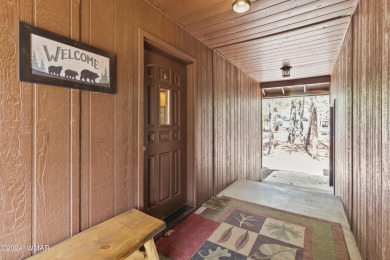 Charming single-level cabin in Pinetop Country Club, offering 1 on Pinetop Lakes Country Club in Arizona - for sale on GolfHomes.com, golf home, golf lot