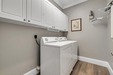 Sitting gracefully on a hilltop corner lot across from the on Southwood Golf Club in Florida - for sale on GolfHomes.com, golf home, golf lot