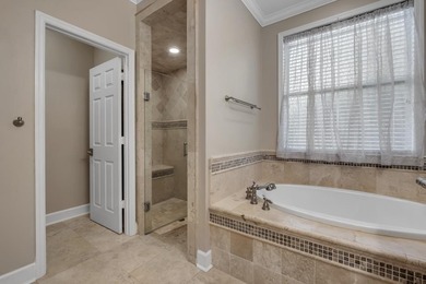 Sitting gracefully on a hilltop corner lot across from the on Southwood Golf Club in Florida - for sale on GolfHomes.com, golf home, golf lot