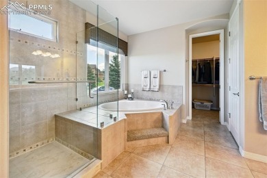 Beautifully situated on a spacious lot with sweeping Front Range on Kings Deer Golf Club in Colorado - for sale on GolfHomes.com, golf home, golf lot