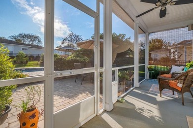 Sitting gracefully on a hilltop corner lot across from the on Southwood Golf Club in Florida - for sale on GolfHomes.com, golf home, golf lot