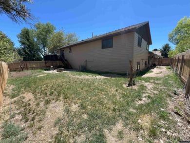 Nestled in the serene ambiance of the prestigious golf course on Riverton Country Club in Wyoming - for sale on GolfHomes.com, golf home, golf lot