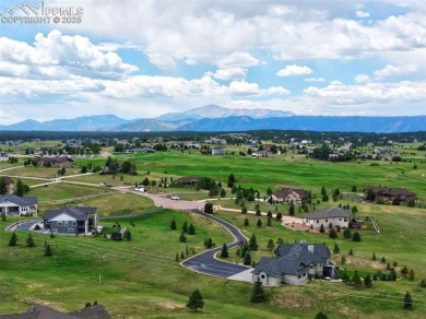 Beautifully situated on a spacious lot with sweeping Front Range on Kings Deer Golf Club in Colorado - for sale on GolfHomes.com, golf home, golf lot