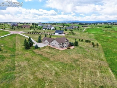 Beautifully situated on a spacious lot with sweeping Front Range on Kings Deer Golf Club in Colorado - for sale on GolfHomes.com, golf home, golf lot