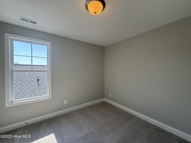 Premium lot! This gorgeous new construction home highlights on Riverwood Golf and Athletic Club in North Carolina - for sale on GolfHomes.com, golf home, golf lot