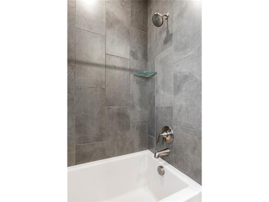 Modern design meets luxury living in this impressive 4-bedroom on Big Sugar Golf Club in Arkansas - for sale on GolfHomes.com, golf home, golf lot