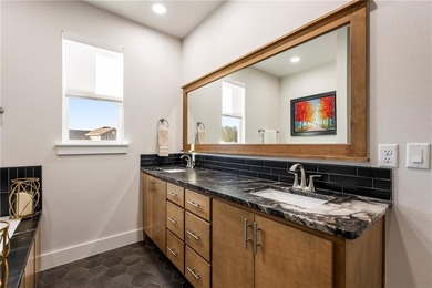 Modern design meets luxury living in this impressive 4-bedroom on Big Sugar Golf Club in Arkansas - for sale on GolfHomes.com, golf home, golf lot