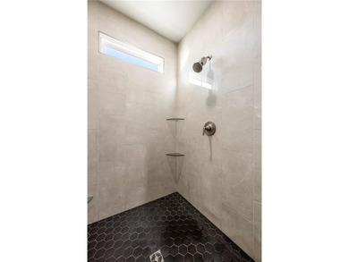 Modern design meets luxury living in this impressive 4-bedroom on Big Sugar Golf Club in Arkansas - for sale on GolfHomes.com, golf home, golf lot