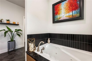 Modern design meets luxury living in this impressive 4-bedroom on Big Sugar Golf Club in Arkansas - for sale on GolfHomes.com, golf home, golf lot