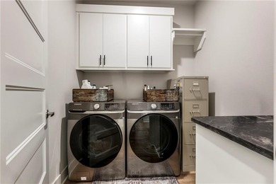 Modern design meets luxury living in this impressive 4-bedroom on Big Sugar Golf Club in Arkansas - for sale on GolfHomes.com, golf home, golf lot