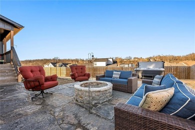 Modern design meets luxury living in this impressive 4-bedroom on Big Sugar Golf Club in Arkansas - for sale on GolfHomes.com, golf home, golf lot