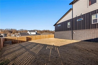 Modern design meets luxury living in this impressive 4-bedroom on Big Sugar Golf Club in Arkansas - for sale on GolfHomes.com, golf home, golf lot
