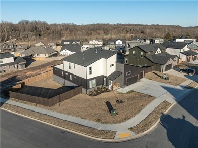 Modern design meets luxury living in this impressive 4-bedroom on Big Sugar Golf Club in Arkansas - for sale on GolfHomes.com, golf home, golf lot