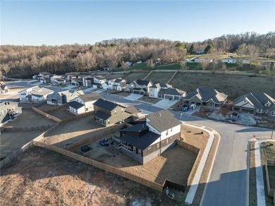 Modern design meets luxury living in this impressive 4-bedroom on Big Sugar Golf Club in Arkansas - for sale on GolfHomes.com, golf home, golf lot