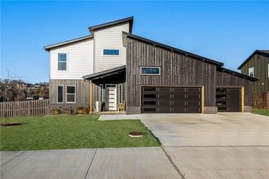 Modern design meets luxury living in this impressive 4-bedroom on Big Sugar Golf Club in Arkansas - for sale on GolfHomes.com, golf home, golf lot