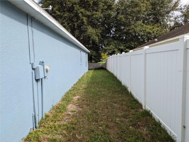 AS IS. A turn-key and versatile 4-bedroom house. New roof on Meadow Oaks Golf and Country Club in Florida - for sale on GolfHomes.com, golf home, golf lot