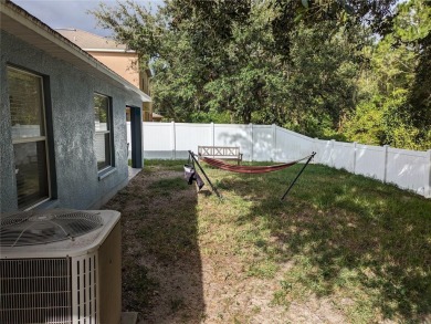 AS IS. A turn-key and versatile 4-bedroom house. New roof on Meadow Oaks Golf and Country Club in Florida - for sale on GolfHomes.com, golf home, golf lot