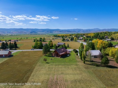 This beautiful log home combines rustic charm with modern on Star Valley RV Golf Course in Wyoming - for sale on GolfHomes.com, golf home, golf lot