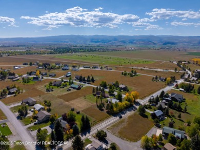 This beautiful log home combines rustic charm with modern on Star Valley RV Golf Course in Wyoming - for sale on GolfHomes.com, golf home, golf lot