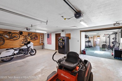 This beautiful log home combines rustic charm with modern on Star Valley RV Golf Course in Wyoming - for sale on GolfHomes.com, golf home, golf lot