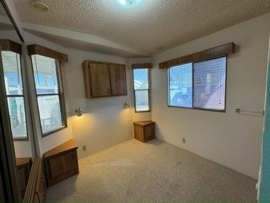 This 1989 Castle Park Model Home is in a beautiful 55+ age on Voyager RV Resort and Golf Course in Arizona - for sale on GolfHomes.com, golf home, golf lot