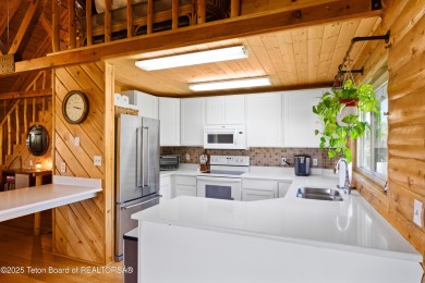 This beautiful log home combines rustic charm with modern on Star Valley RV Golf Course in Wyoming - for sale on GolfHomes.com, golf home, golf lot