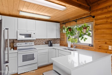 This beautiful log home combines rustic charm with modern on Star Valley RV Golf Course in Wyoming - for sale on GolfHomes.com, golf home, golf lot