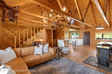 This beautiful log home combines rustic charm with modern on Star Valley RV Golf Course in Wyoming - for sale on GolfHomes.com, golf home, golf lot