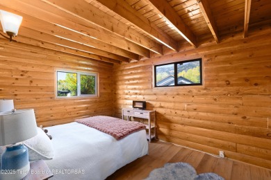This beautiful log home combines rustic charm with modern on Star Valley RV Golf Course in Wyoming - for sale on GolfHomes.com, golf home, golf lot