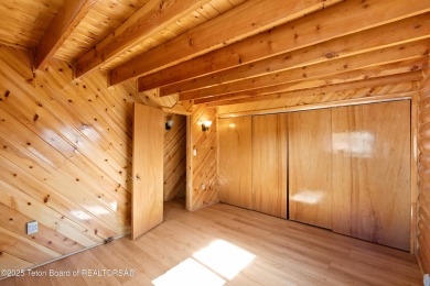 This beautiful log home combines rustic charm with modern on Star Valley RV Golf Course in Wyoming - for sale on GolfHomes.com, golf home, golf lot