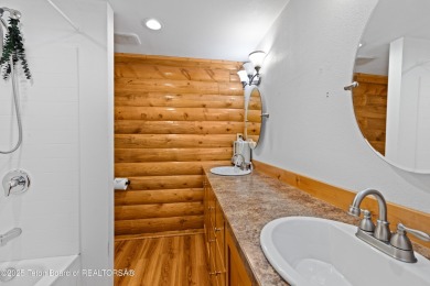 This beautiful log home combines rustic charm with modern on Star Valley RV Golf Course in Wyoming - for sale on GolfHomes.com, golf home, golf lot
