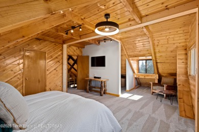 This beautiful log home combines rustic charm with modern on Star Valley RV Golf Course in Wyoming - for sale on GolfHomes.com, golf home, golf lot
