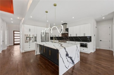 Experience modern luxury in this newly built custom farmhouse on East Lake Golf Club in Georgia - for sale on GolfHomes.com, golf home, golf lot