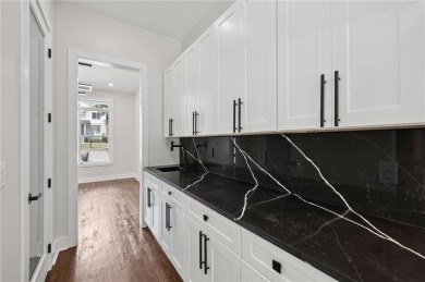 Experience modern luxury in this newly built custom farmhouse on East Lake Golf Club in Georgia - for sale on GolfHomes.com, golf home, golf lot