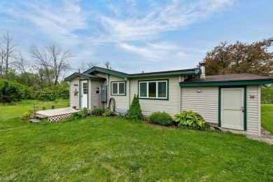 At the end of a quiet private road, sits this charming cedar on Alburg Golf Links in Vermont - for sale on GolfHomes.com, golf home, golf lot