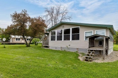 At the end of a quiet private road, sits this charming cedar on Alburg Golf Links in Vermont - for sale on GolfHomes.com, golf home, golf lot