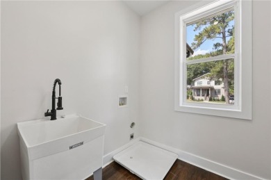 Experience modern luxury in this newly built custom farmhouse on East Lake Golf Club in Georgia - for sale on GolfHomes.com, golf home, golf lot