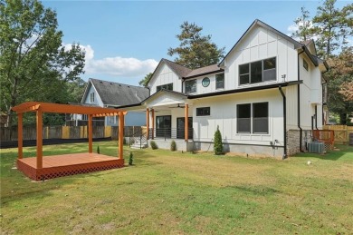 Experience modern luxury in this newly built custom farmhouse on East Lake Golf Club in Georgia - for sale on GolfHomes.com, golf home, golf lot