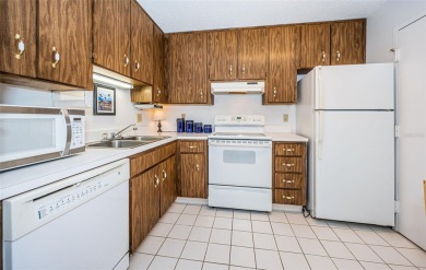 This 2-bedroom, 1.5-bath condo comes fully furnished and on The Dunedin Country Club in Florida - for sale on GolfHomes.com, golf home, golf lot