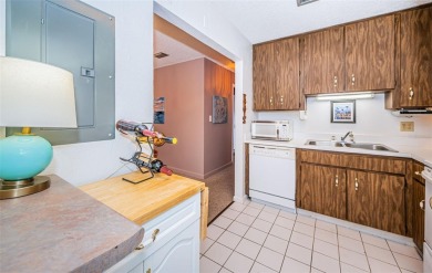 This 2-bedroom, 1.5-bath condo comes fully furnished and on The Dunedin Country Club in Florida - for sale on GolfHomes.com, golf home, golf lot