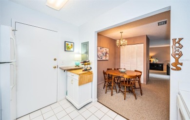 This 2-bedroom, 1.5-bath condo comes fully furnished and on The Dunedin Country Club in Florida - for sale on GolfHomes.com, golf home, golf lot