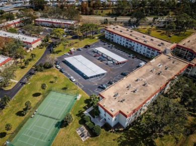 This 2-bedroom, 1.5-bath condo comes fully furnished and on The Dunedin Country Club in Florida - for sale on GolfHomes.com, golf home, golf lot